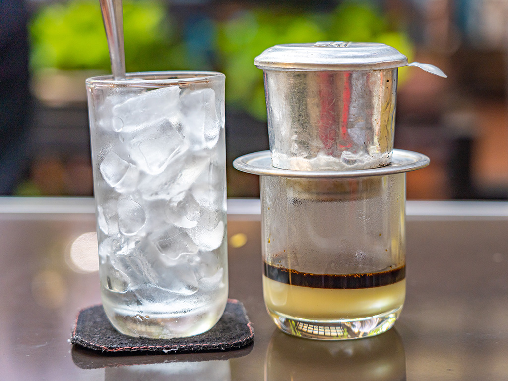 Although some rare old coffee shops make coffee using cloth nets, making coffee with iconic Vietnamese filters (the phin) is more practical and hence more popular.