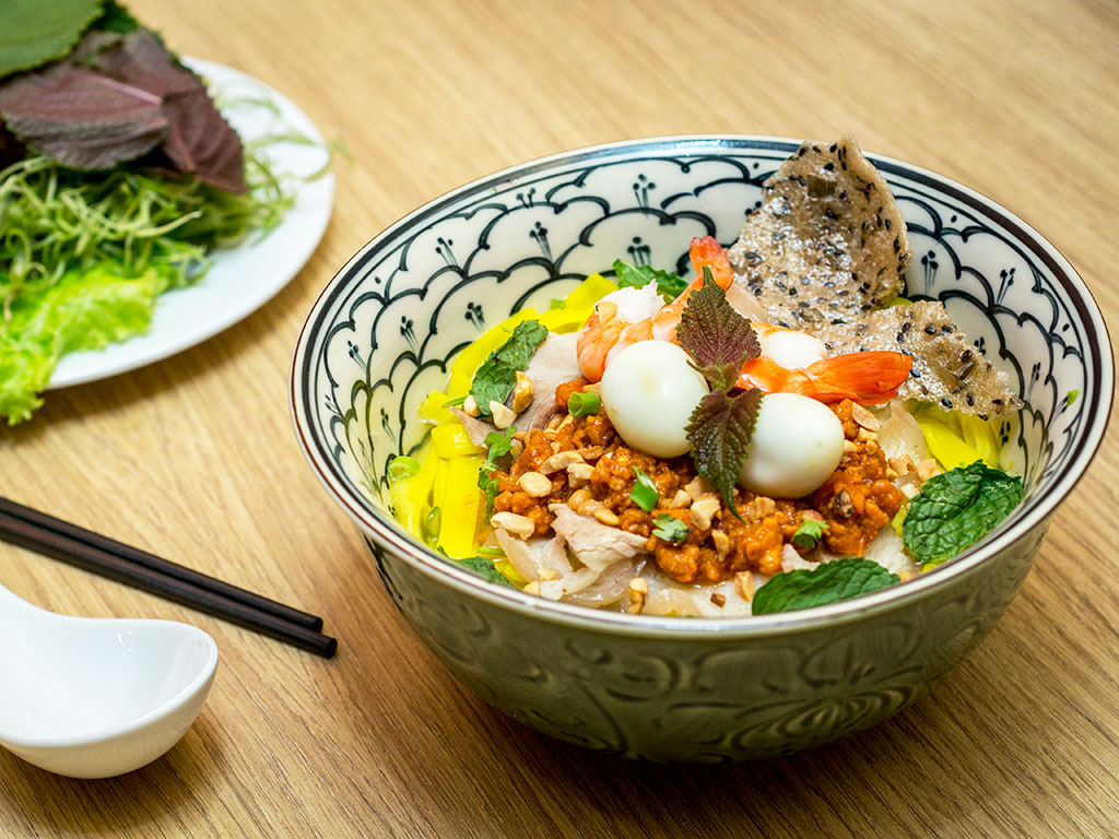 The name Mi Quang (Quang noodle) tells its own story about the origin of a symbolic dish from Central Vietnam - Quang Nam Province.
